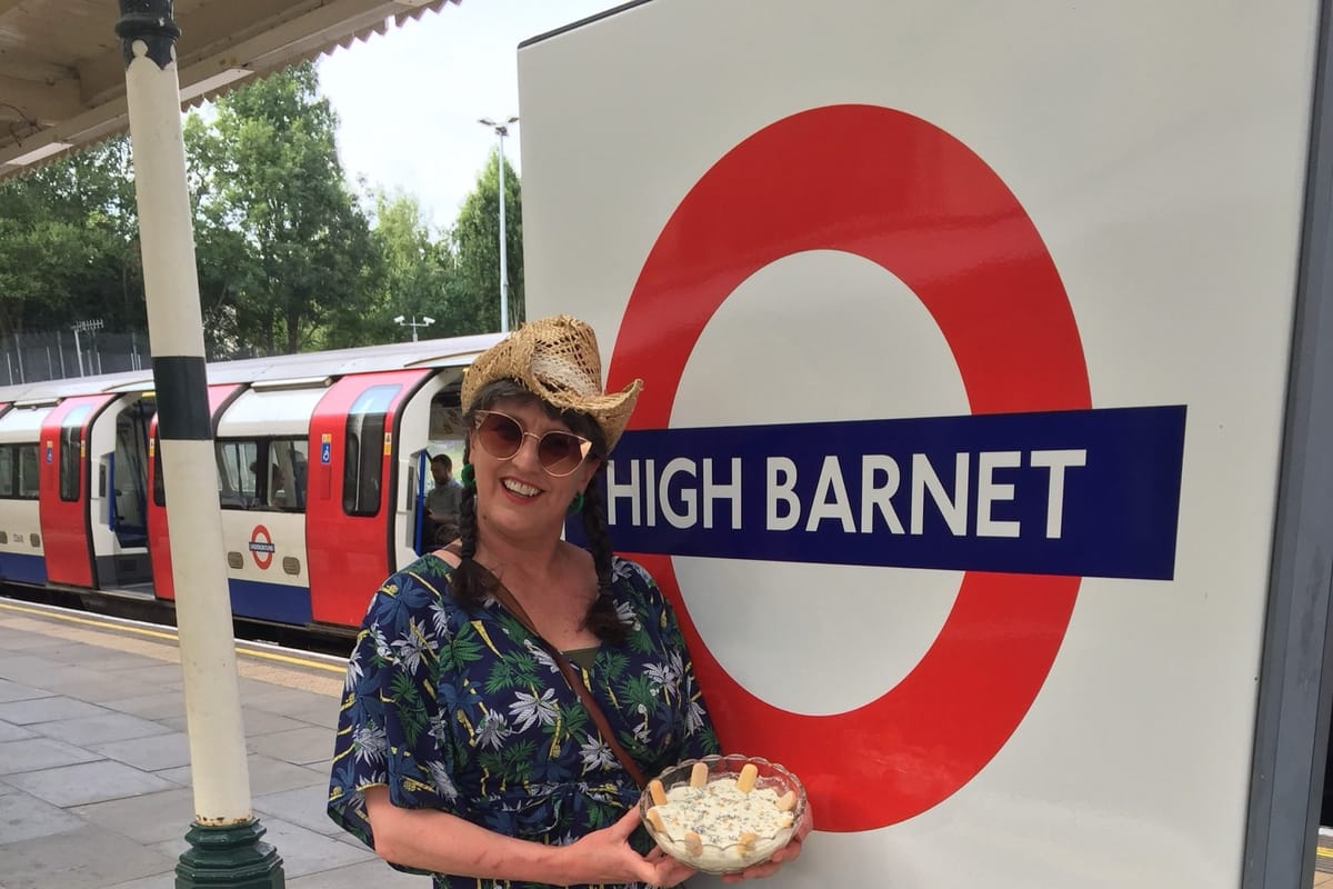 Jenny Hammerton of Silver Screen Suppers holding Pola Negri's banana trifle at High Barnet Tube station in London