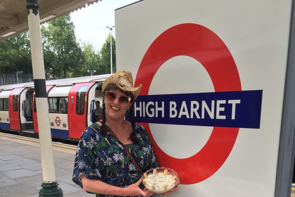 Jenny Hammerton of Silver Screen Suppers holding Pola Negri's banana trifle at High Barnet Tube station in London